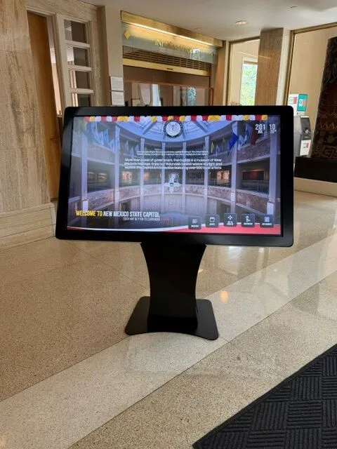 NoviSign digital wayfinding kiosk welcome screen at New Mexico State Capitol entrance