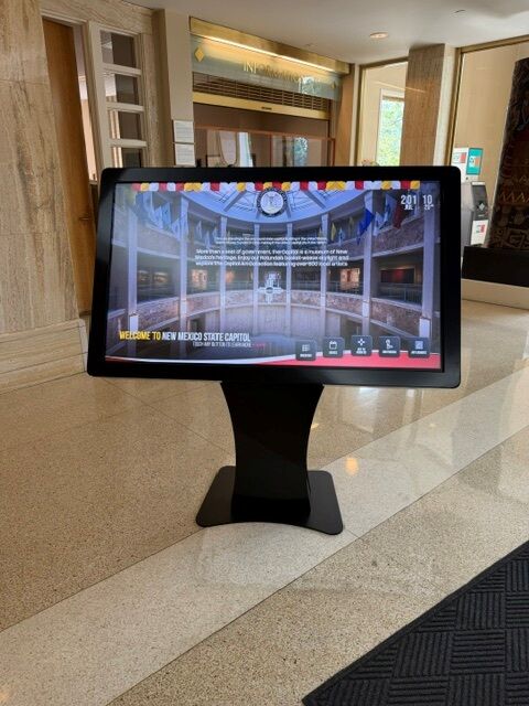 NoviSign digital wayfinding kiosk welcome screen at New Mexico State Capitol entrance