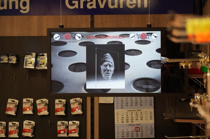 Pyramid TV display in the store, hung from the ceiling Pyramid digital display